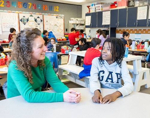 Hayfield Elementary teacher Nicole Johnson chats with a student.