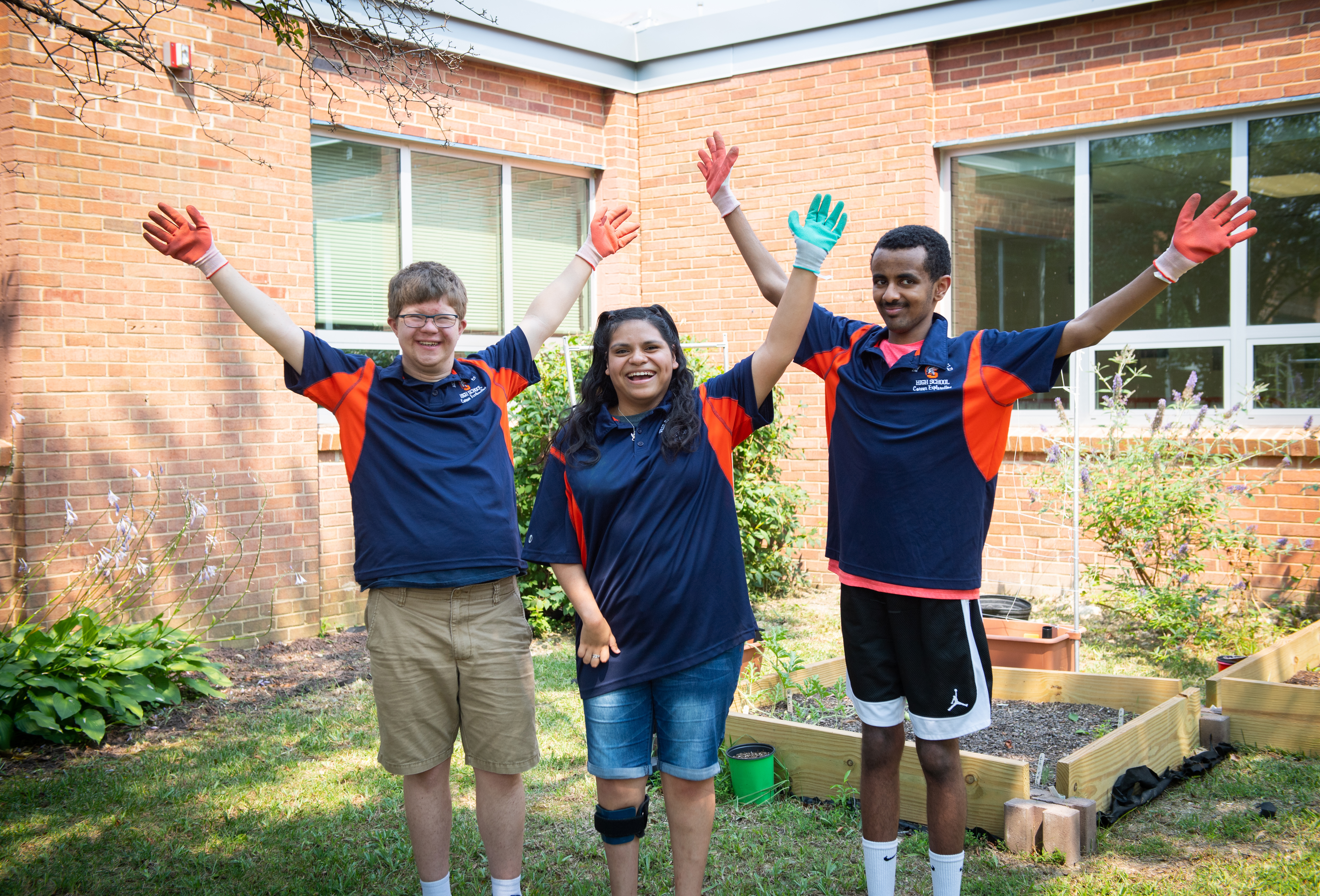 Getting the job done: John, Ariana and Yisak worked with other students to transform this green space.