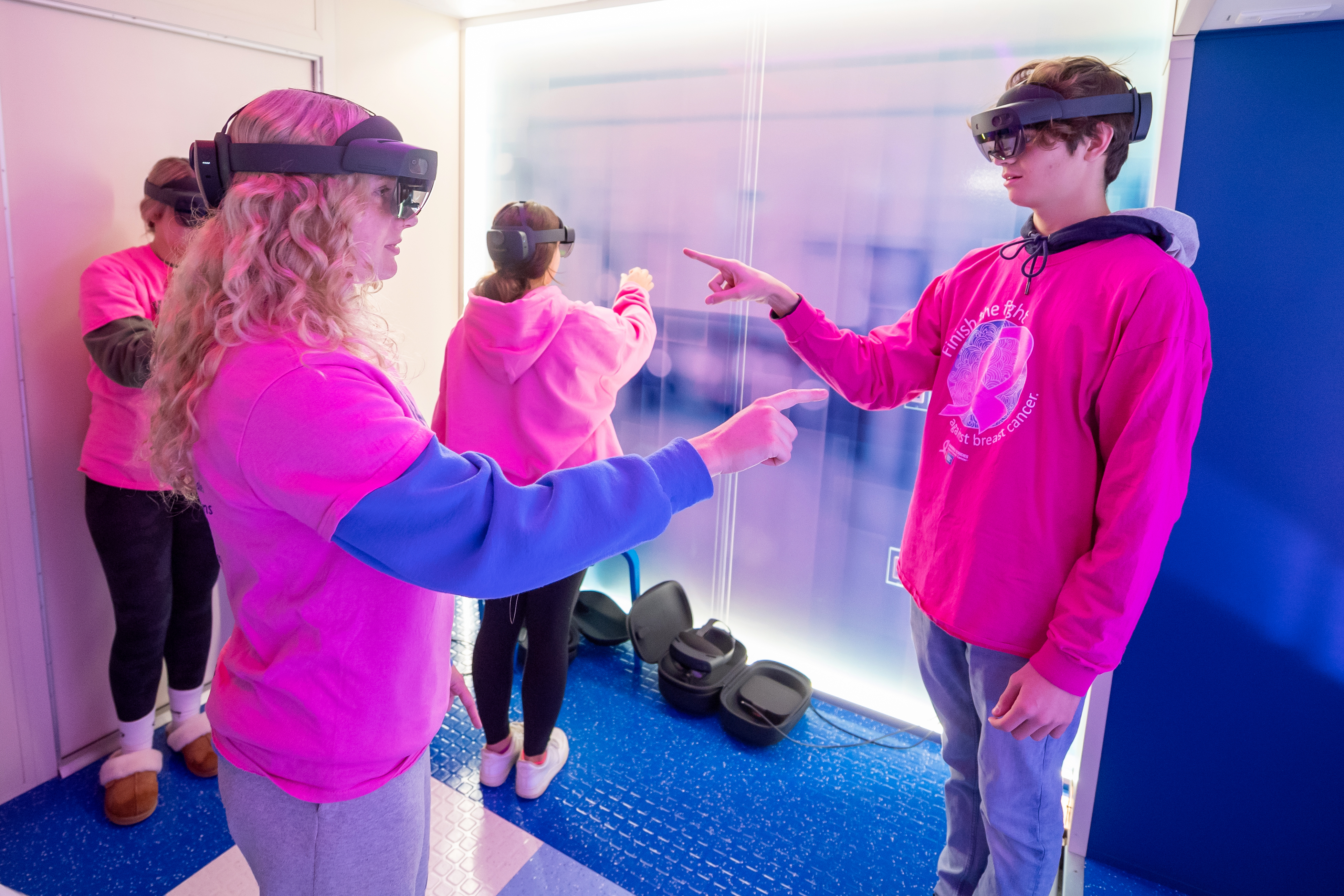 Medical science students use HoloLens technology aboard the ILC. 