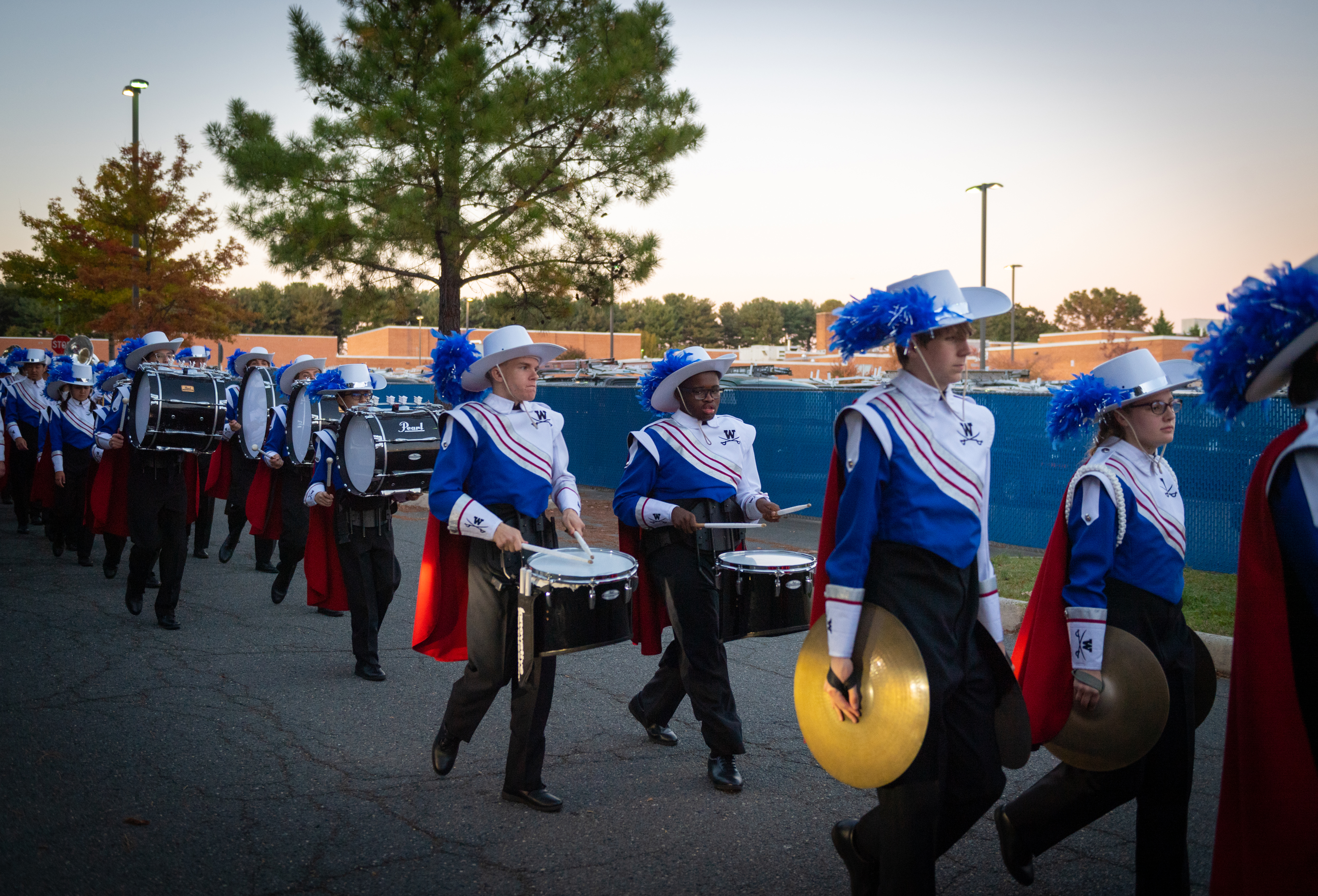 The Woodson drumline marches to the football field. 