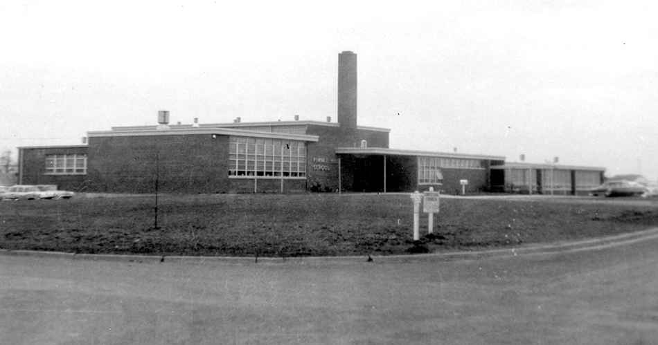 Photograph of the front entrance of Pimmit Hills Elementary School taken in 1958.
