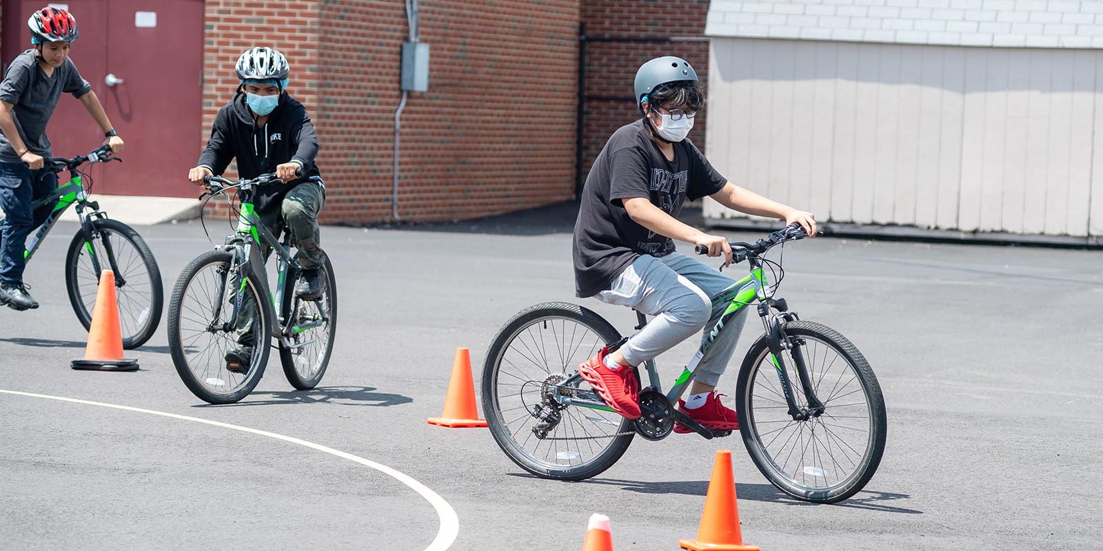 A Poe MS sixth-grader navigates a bike around cones.