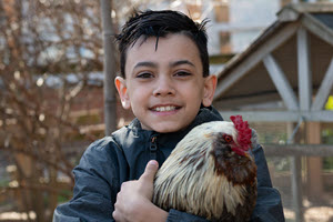 student holding chicken