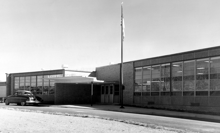 Black and white photograph of the front exterior of Masonville Elementary School.