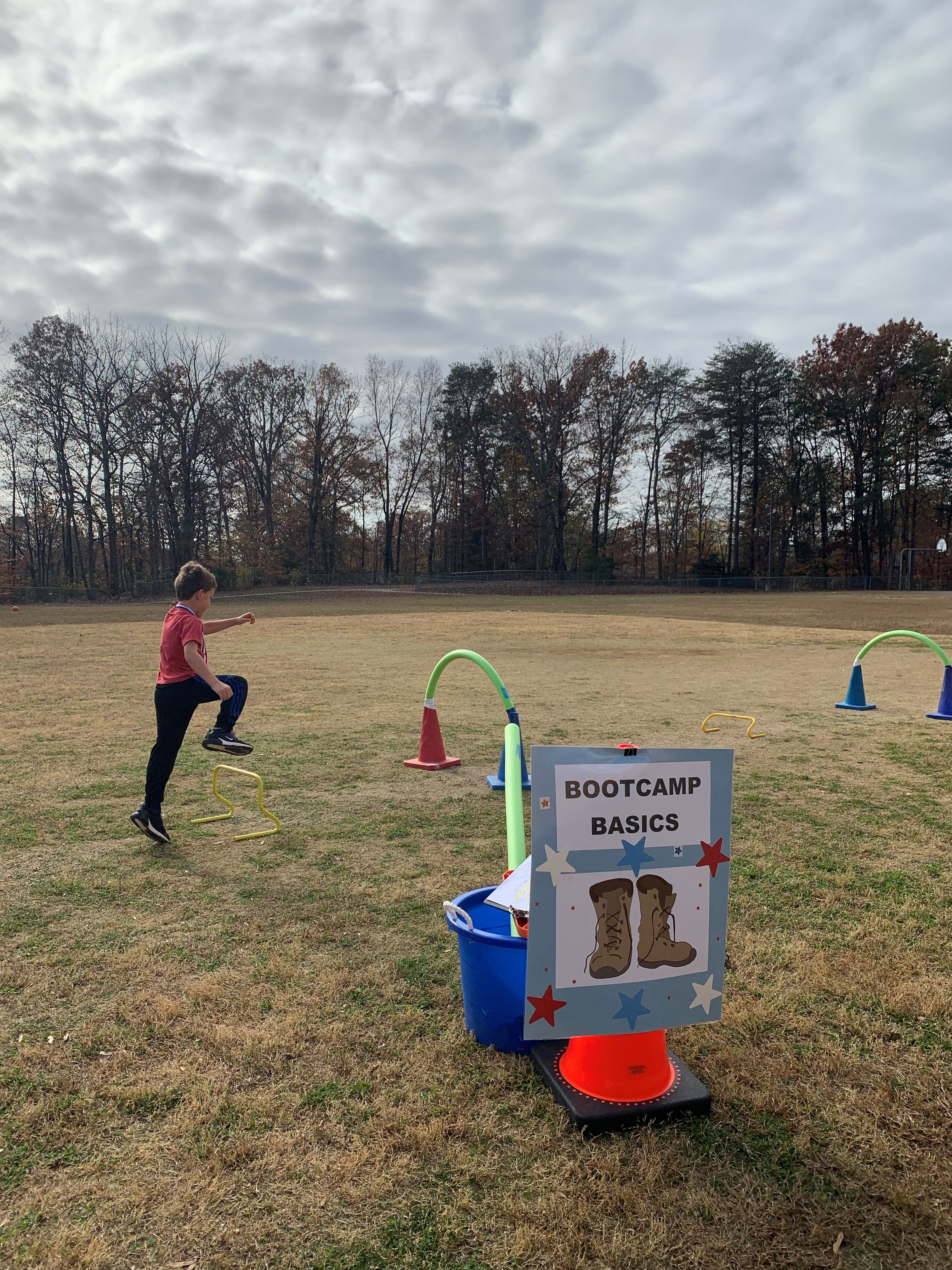 Students tackle a mock boot camp that aims to highlight the importance of physical fitness in the military at Orange Hunt Elementary School's Veterans Day celebration.