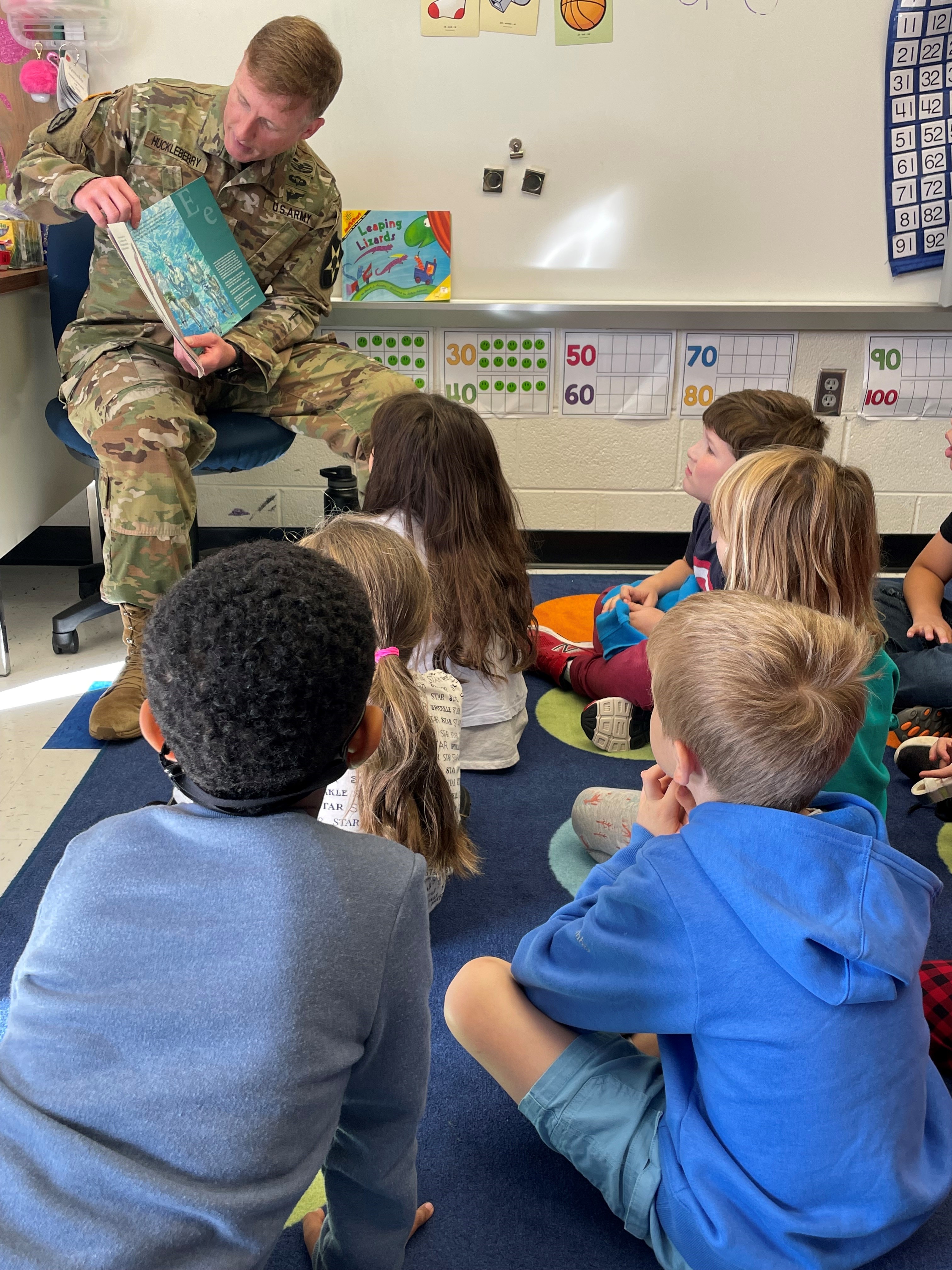 An Orange Hunt Elementary School parent and active duty military member reads to students.