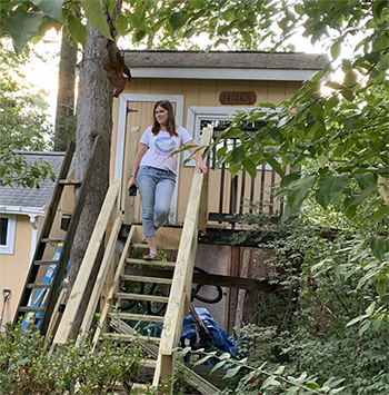 Williams on the steps of her treehouse