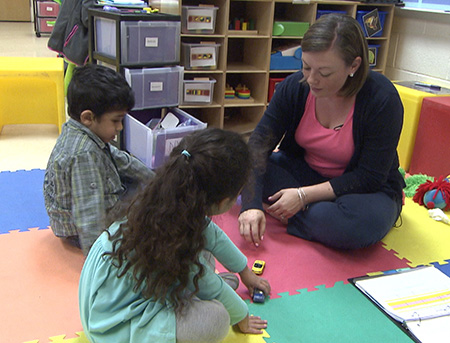 Photo of teacher working with students in a small group