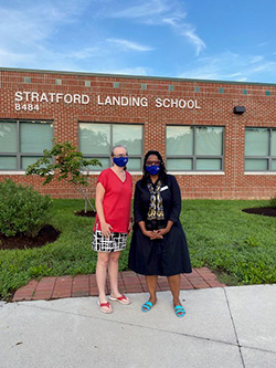 Karen Corbett-Sanders and Karen Keys-Gamarra in front of Stratford Landing Elementary School