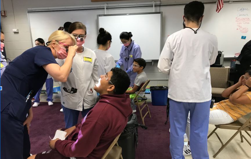 Students receive dental screenings and cleanings through partnerships in the community. 