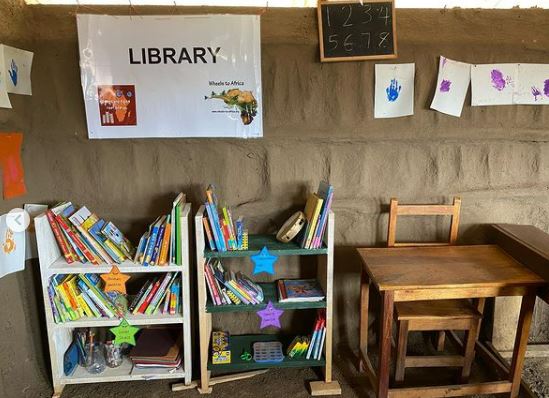 The new library fully stocked with dozens of donated books. 