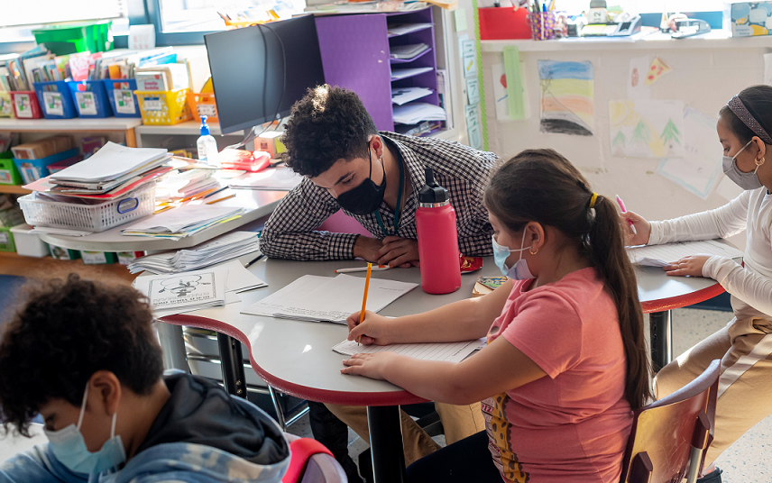 ​  Julian Consolla helps students with a lesson at Mount Eagle Elementary.   ​