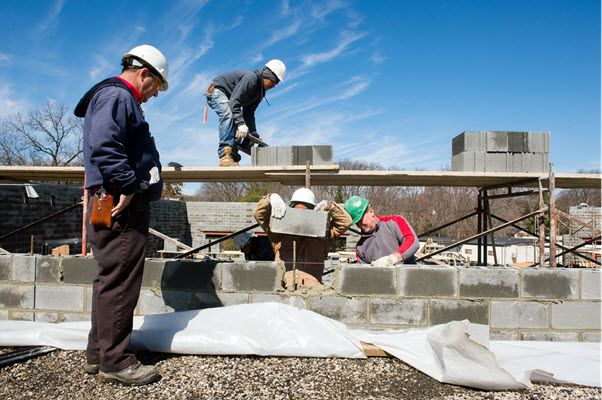 a group of students working on a construction site