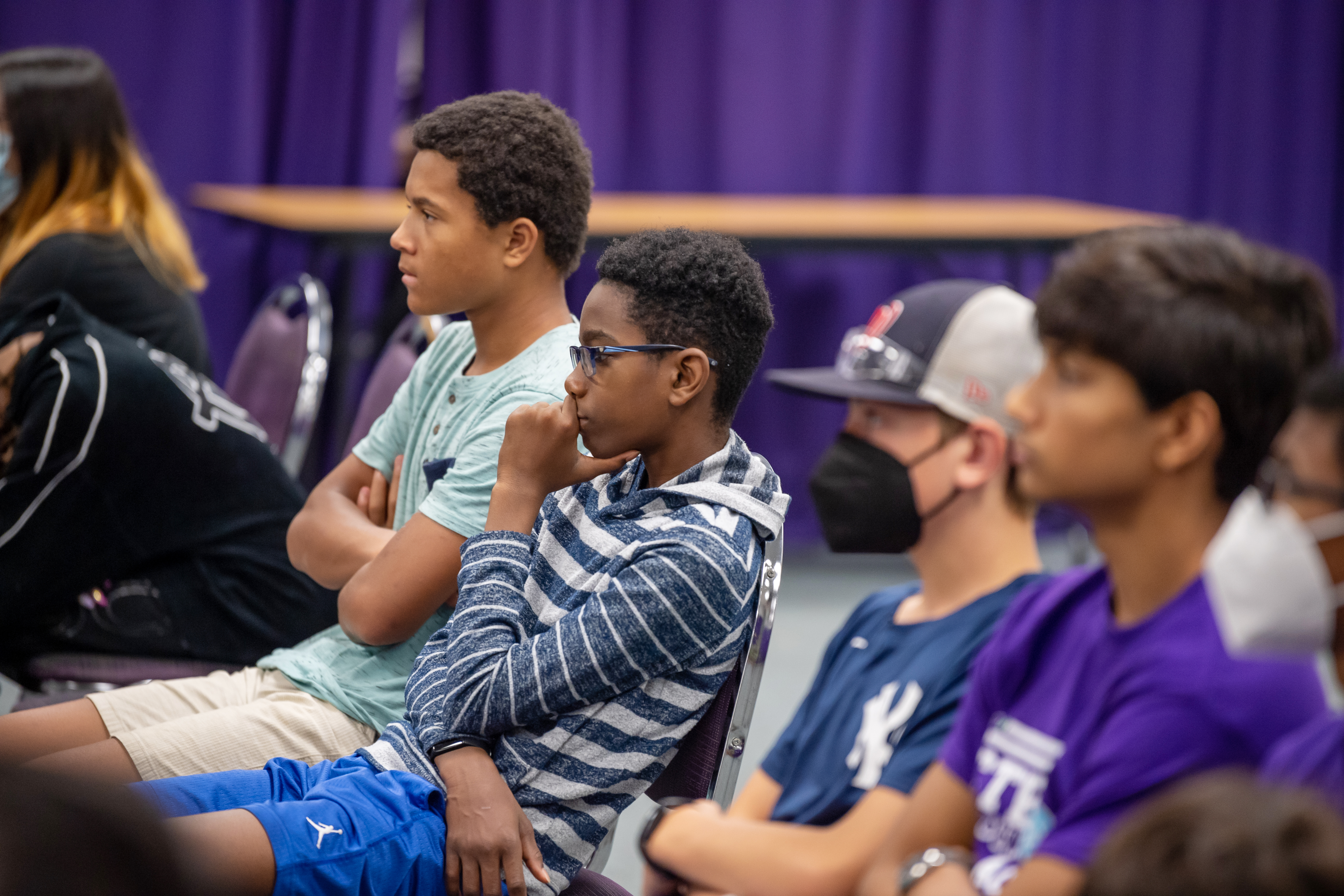 Students listen to the presentation of new NASA images. 