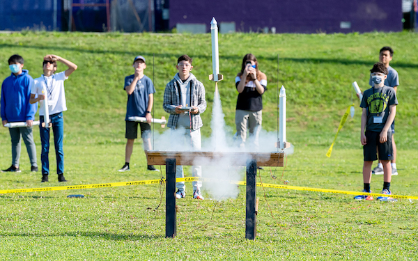 Students set off a rocket. 