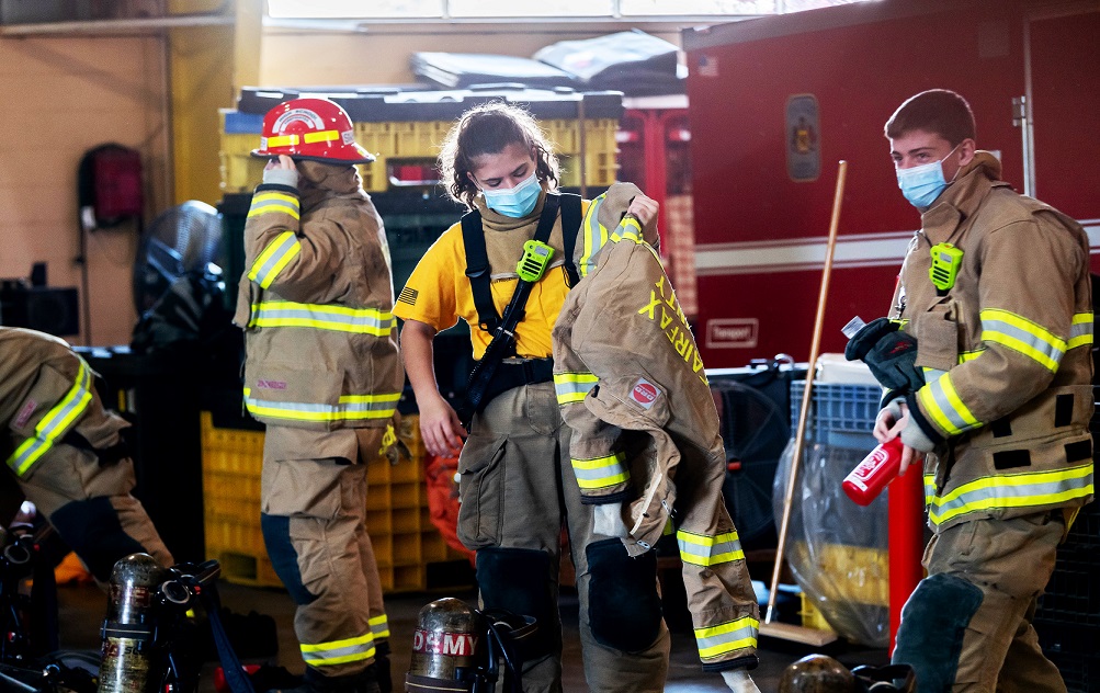 FCPS firefighting students put on more than 60 pounds of gear before drills. 