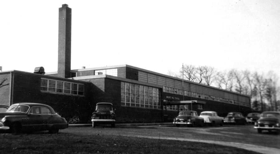 Black and white photograph of the front exterior of Walnut Hill Elementary School.