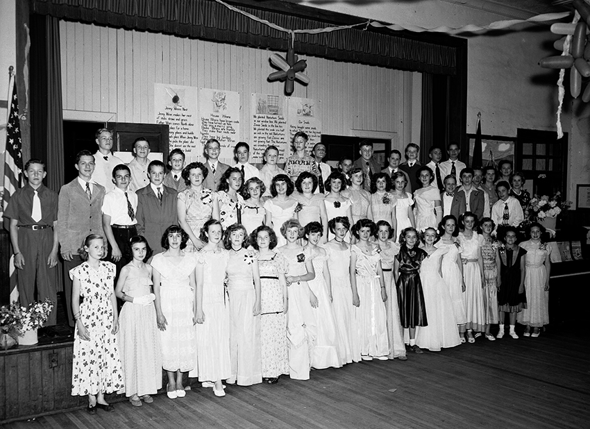 Black and white photograph of Annandale Elementary students in the school’s auditorium.