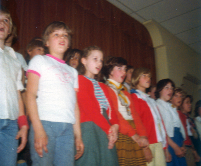 A photograph of students singing.