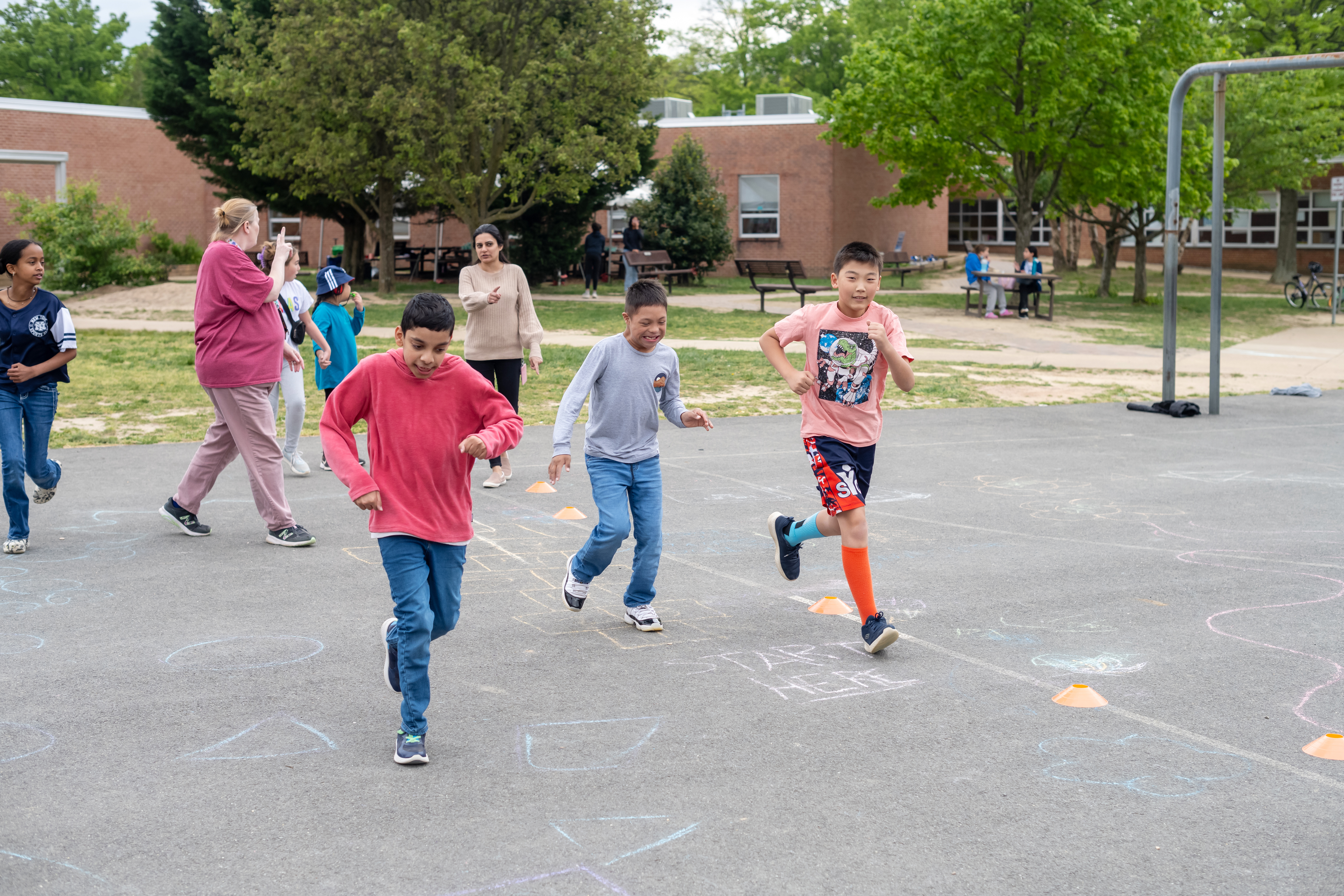 Bush Hill students run together as they practice for the upcoming Little Feet Meet.