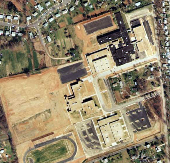 Aerial photograph of the Bryant Intermediate School site after its conversion to Groveton High School.