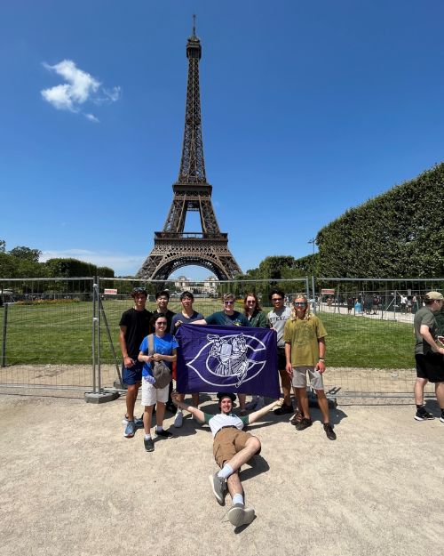 FCPS Chantilly HS students pose in front of the Eiffel Tower for the 2023 VA Ambassadors of Music