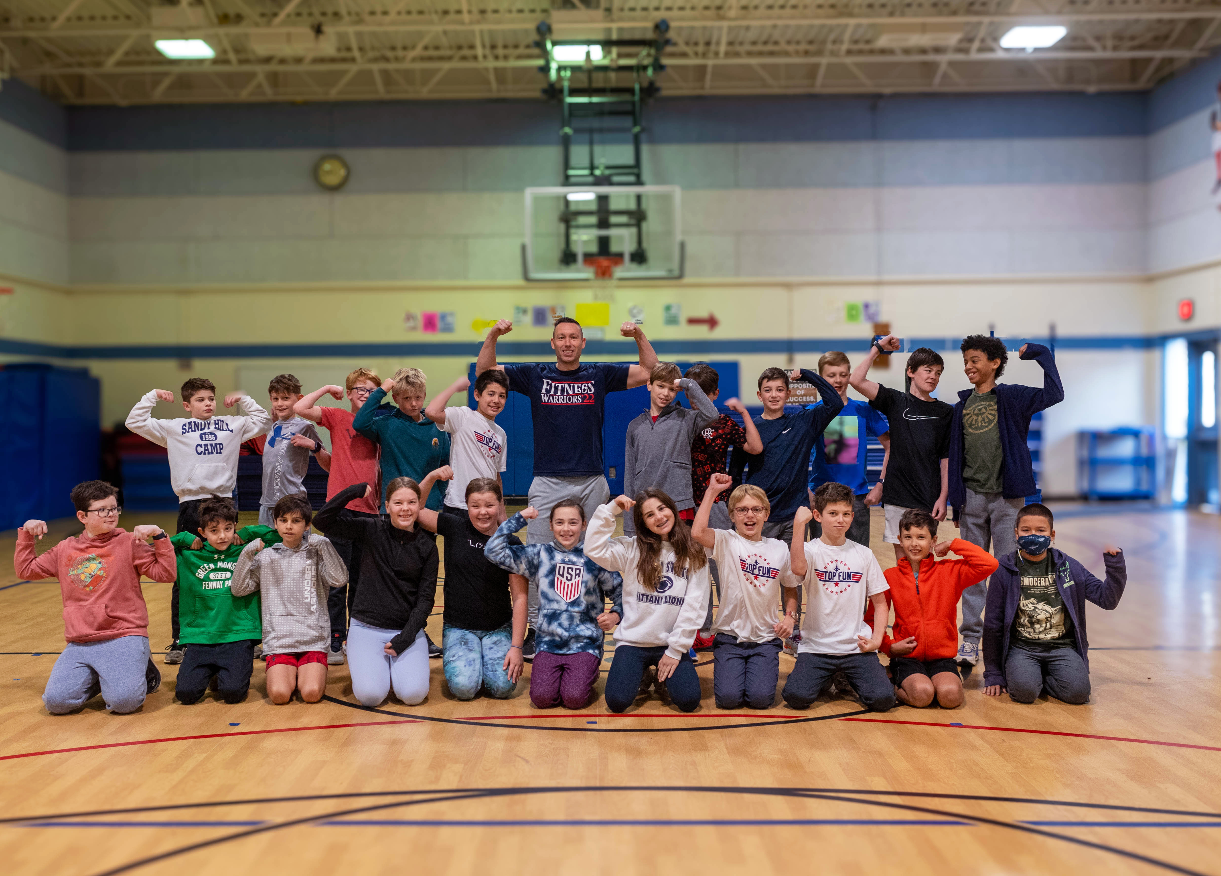 Fitness Warrior creator Jay Levesque and his Monday workout crew flex their muscles.