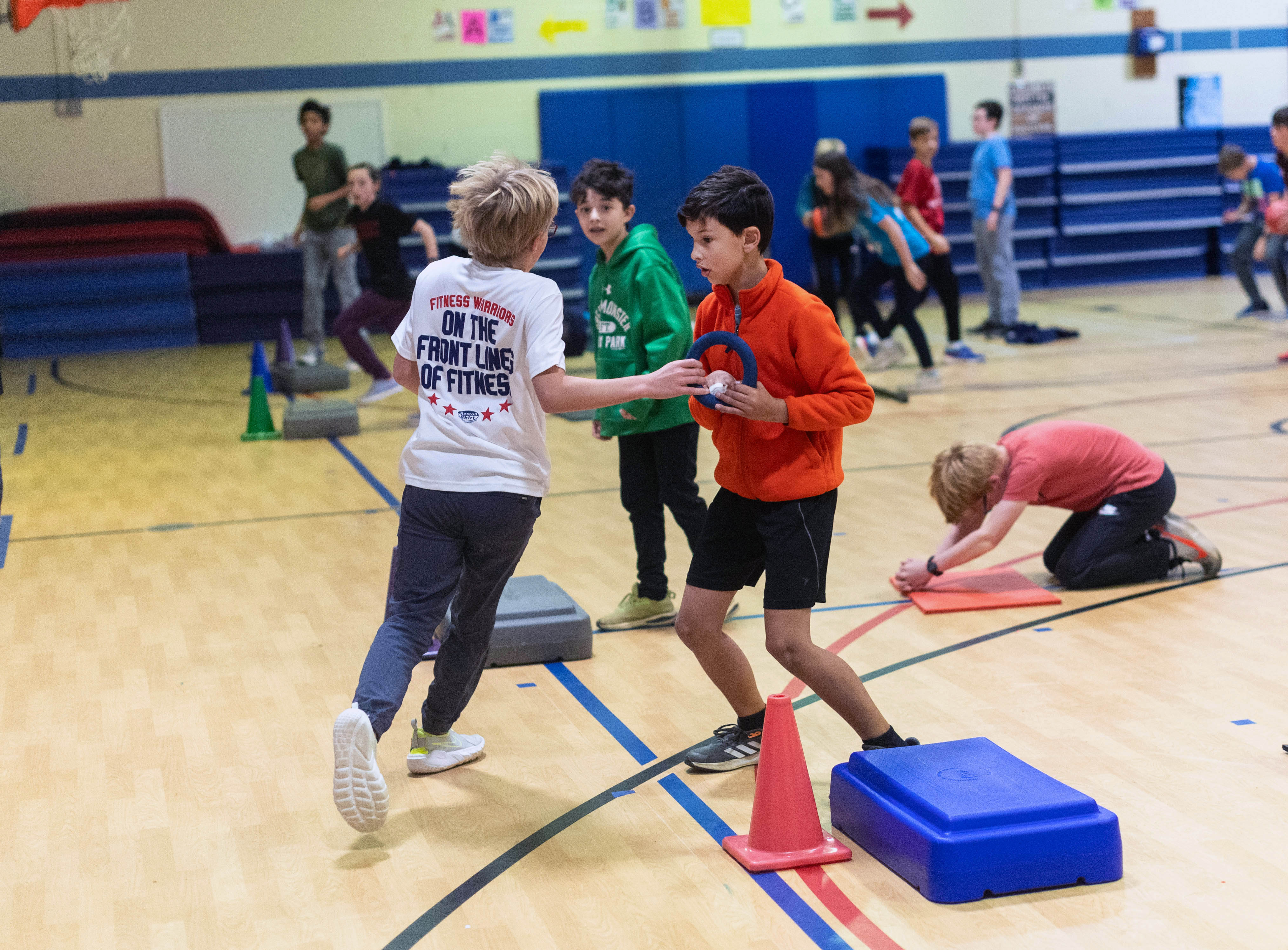 Fitness Warrior participants engage in friendly competition during calisthenics routines. 
