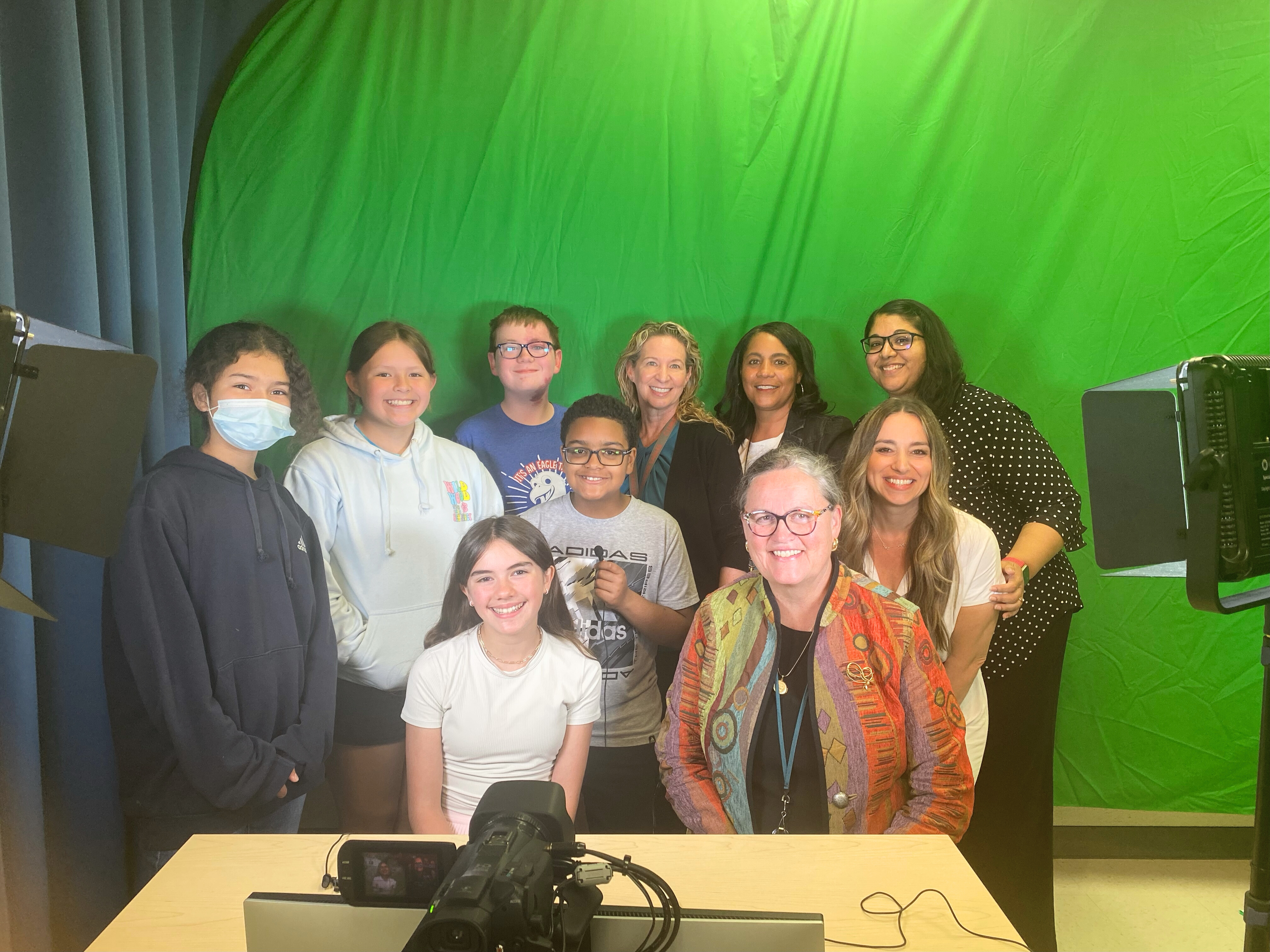 Dr. Reid on the Clermont ES morning news show with students and staff