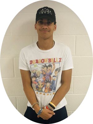 AT Ambassador, Dominic standing in front of a wall with a white shirt and black baseball cap