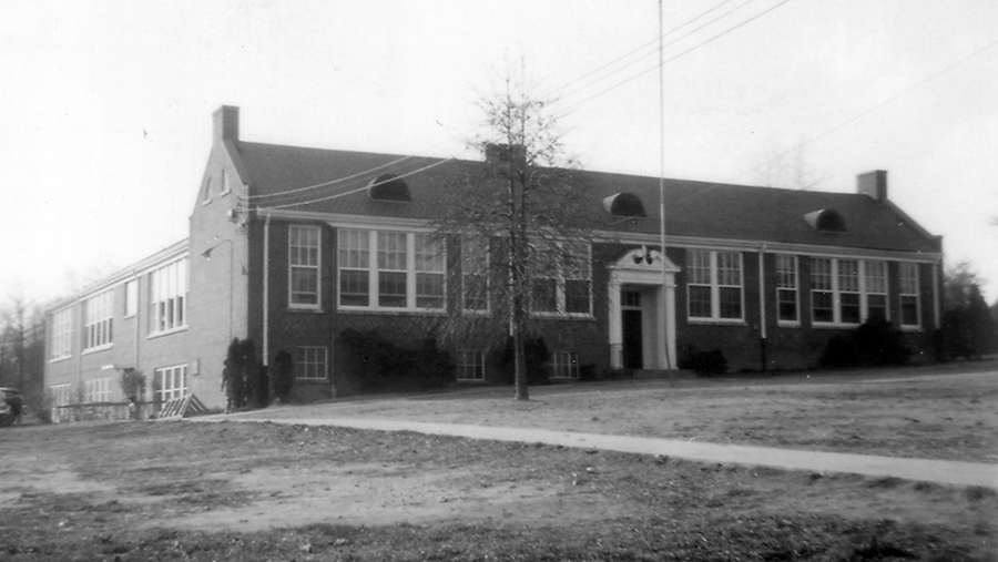 Photograph of the front exterior of Dunn Loring Elementary School taken in 1954.