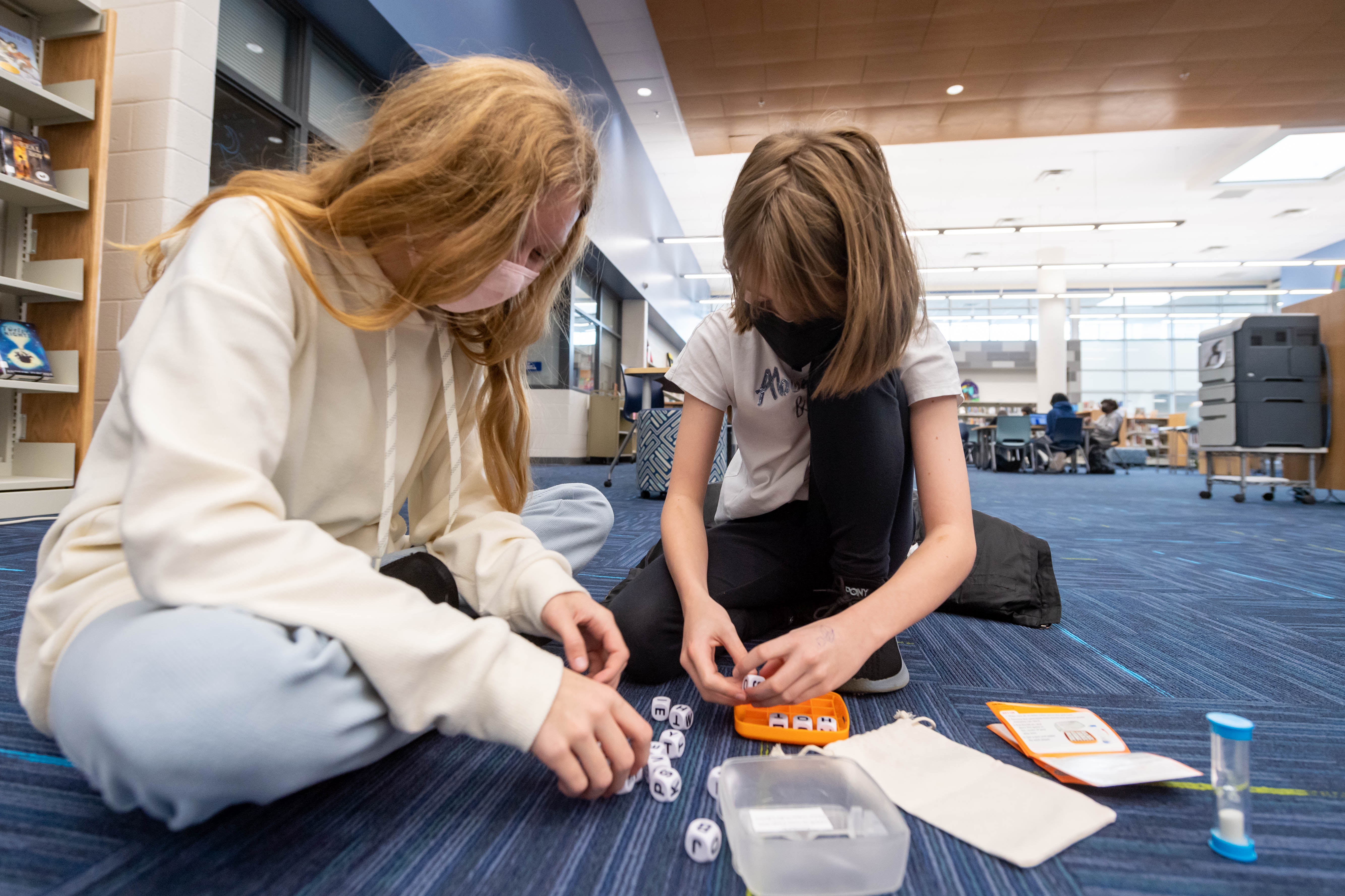 Students play critical thinking board games, purchased with ESSER funds, during school breaks as part of a push to boost collaboration among students after time spent in virtual school during the 2020-2021 school year.