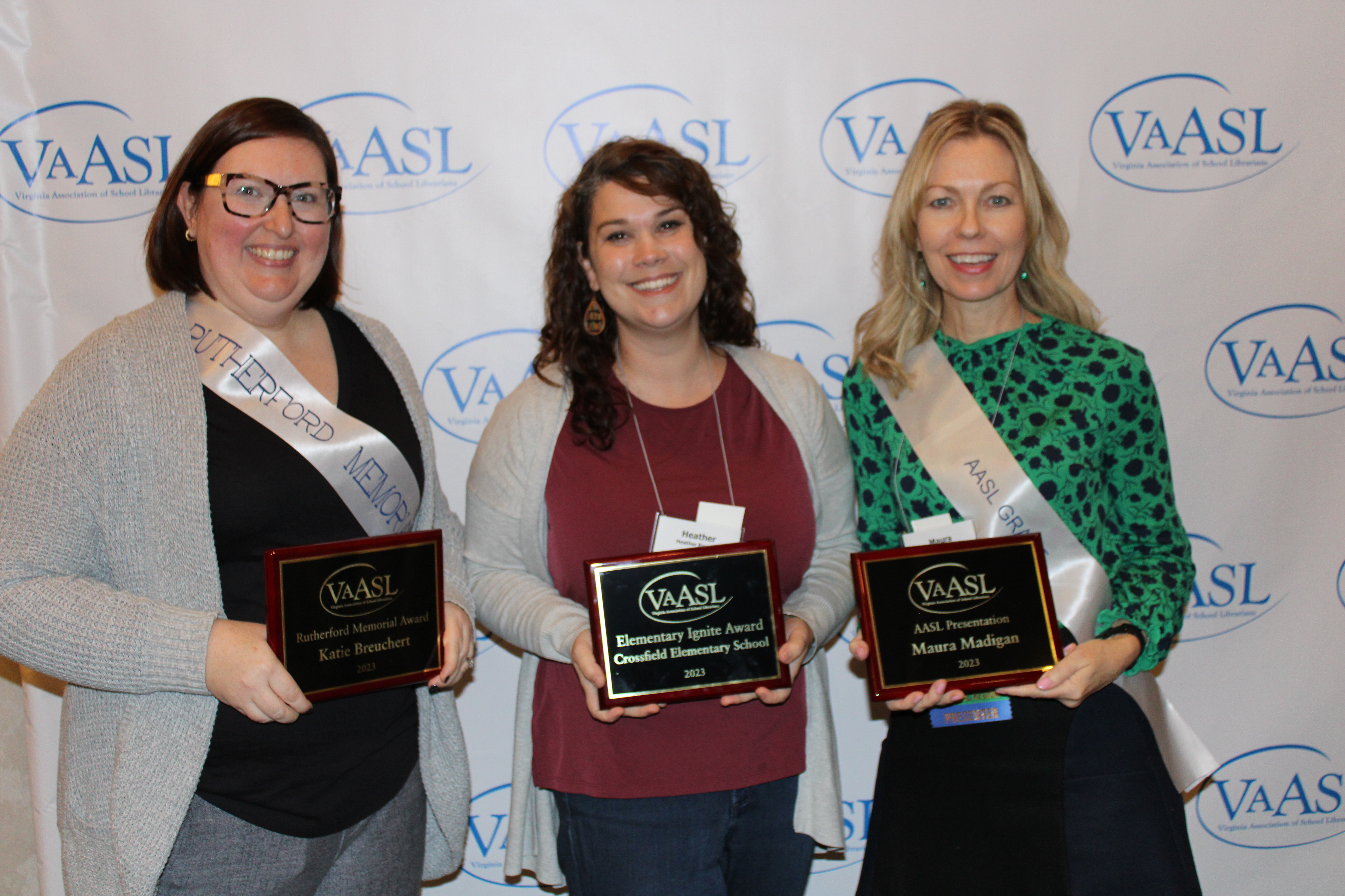Katie Bruechert, Heather Baucum, and Maura Madigan pose with their awards