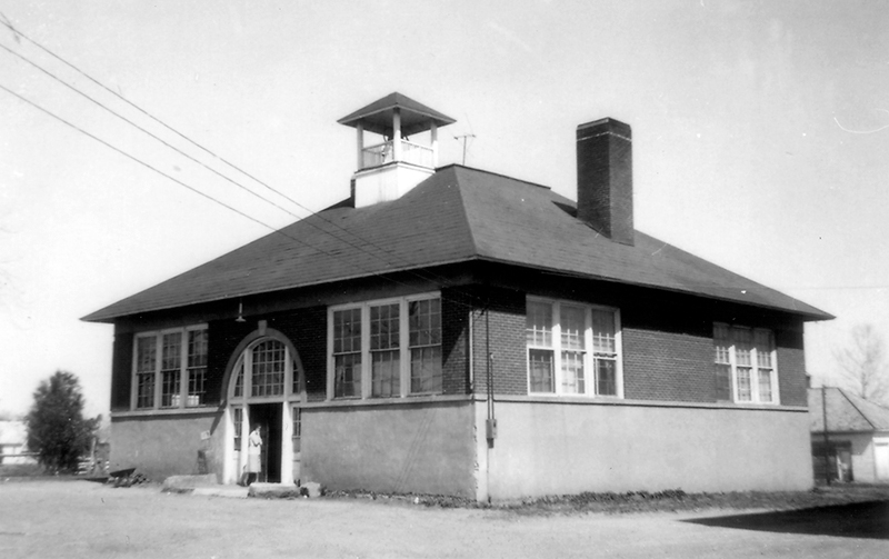 Black and white photograph of the four-room Floris School.