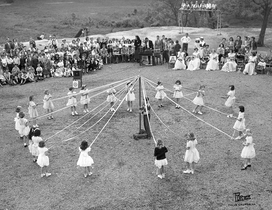 Photograph of students performing a maypole dance at Fairfax Elementary School.