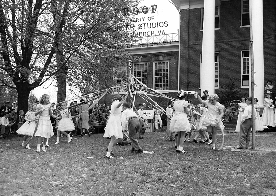 Photograph of students performing a maypole dance at Fairfax Elementary School.