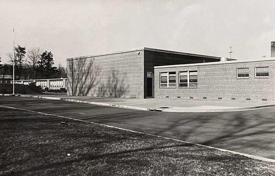 Black and white photograph of the front exterior of Green Acres Elementary School.