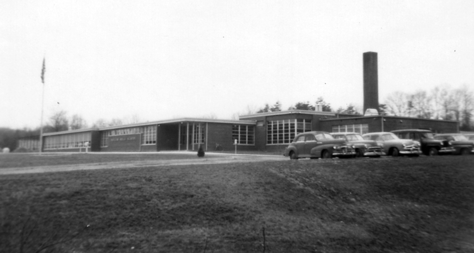Black and white photograph of the front exterior of Hollin Hills Elementary School.