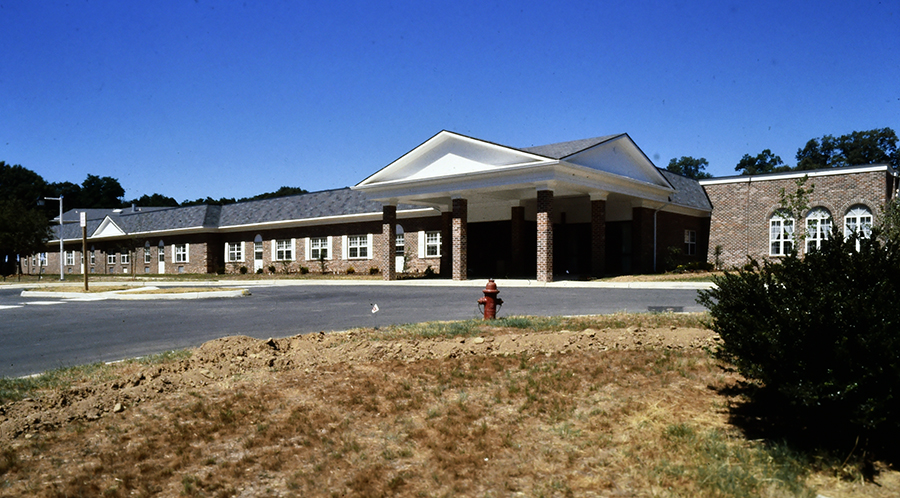 Photograph of the exterior of Hollin Hills Elementary School after it had been converted into the Paul Spring Retirement Community.