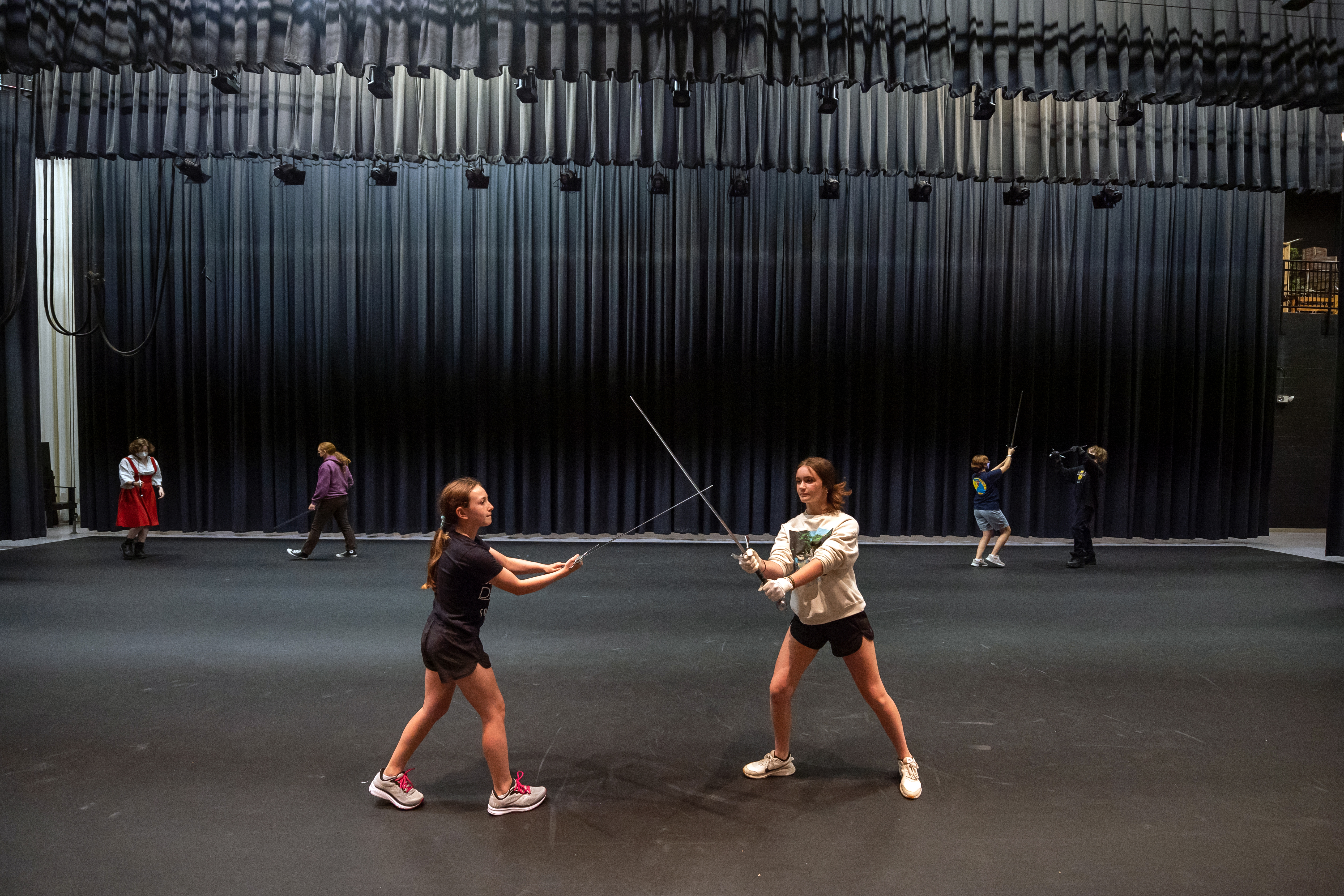Students practice a choreographed sword fight routine during a "Stage Combat" course through an FCPS summer program.