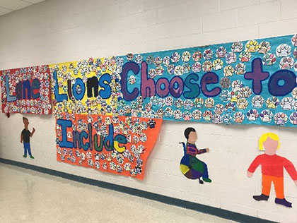 Wall art that reads "Lane Lions Choose to Include"