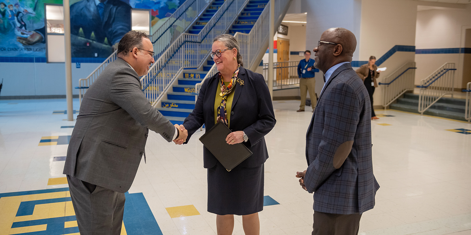 Lewis HS Principal Alfonso Smith and FCPS Superintendent Dr. Michelle Reid greets U.S. Education Sec. Miguel Cardona as he visits Lewis for a mental health town hall.