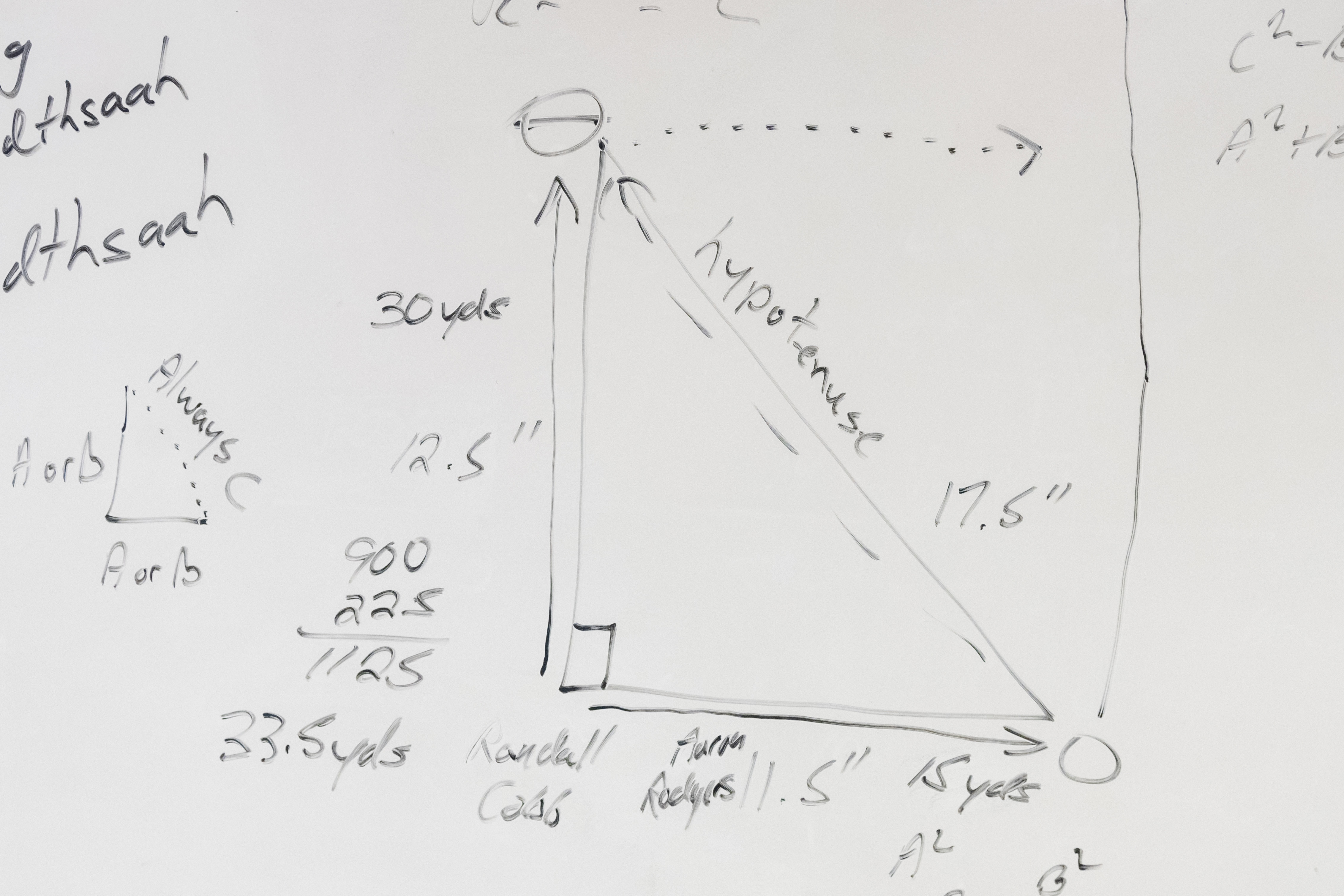 A white board in Paul Malc's class shows his lesson on the Pythagorean Theorem.