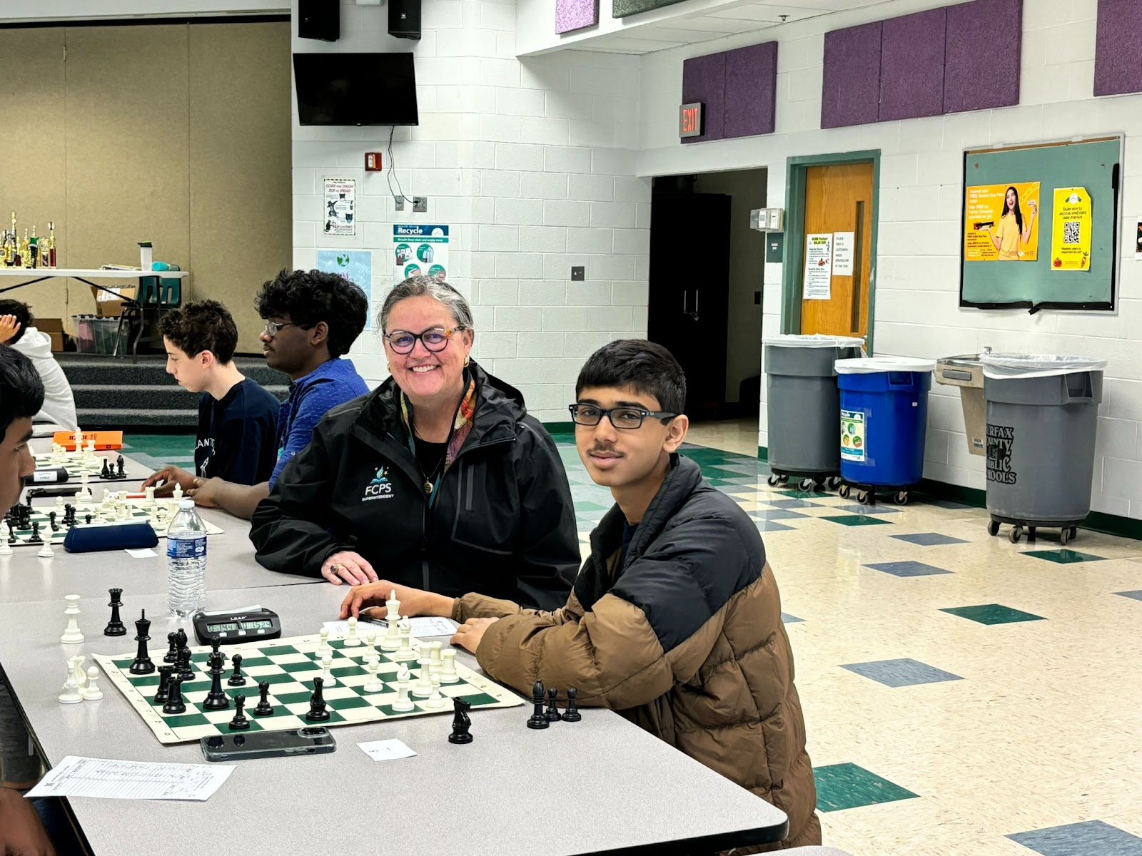 Dr. Reid with a student at the Rachel Carson MS charity chess tournament