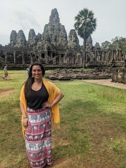 Gina Consumano in front of an antient temple. 