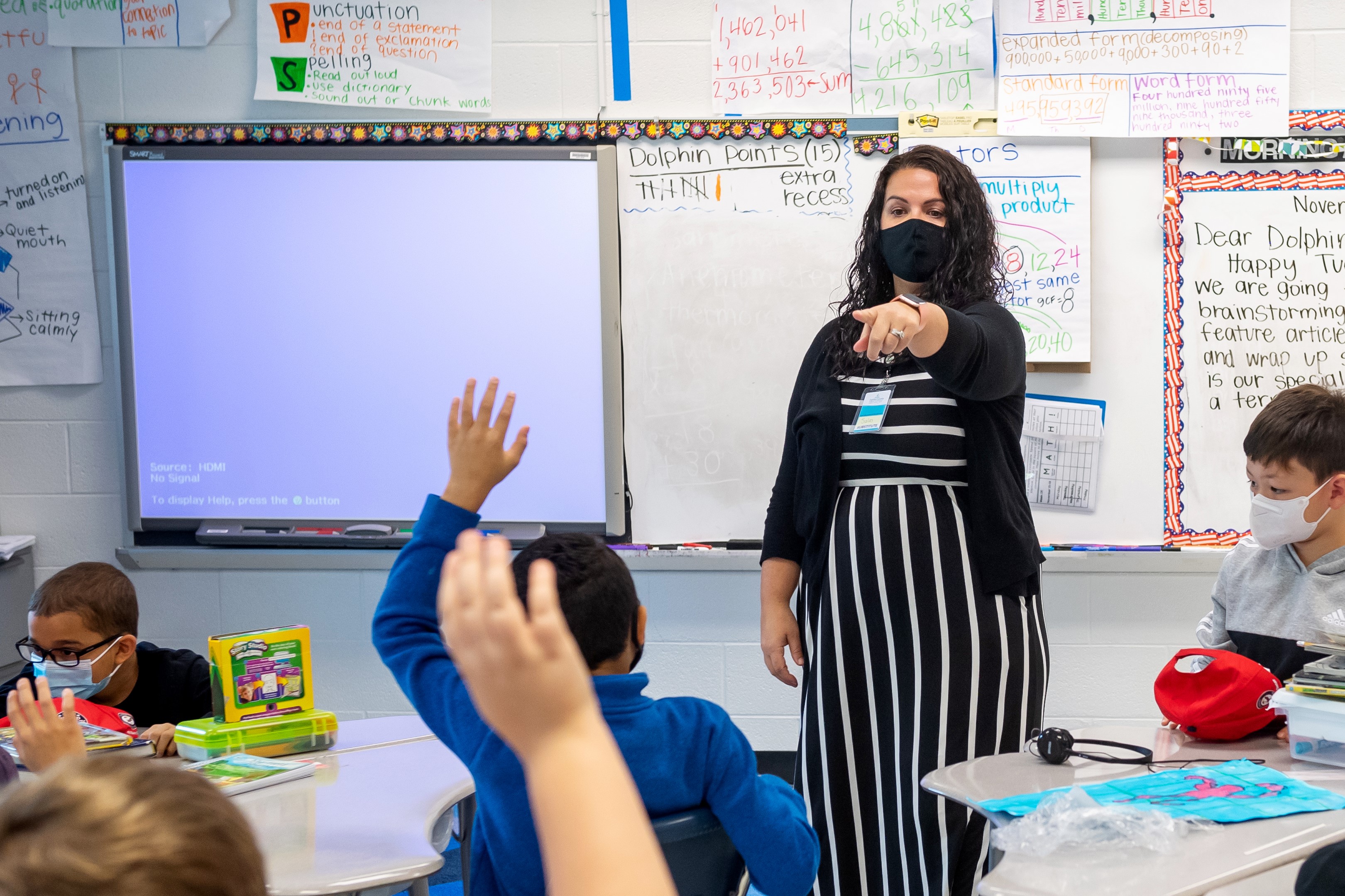FCPS substitute teacher Ashley Salas leads a Fort Belvoir Elementary School classroom in a lesson.