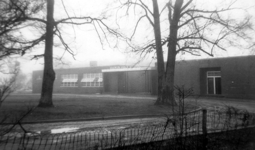 Black and white aerial photograph of Eleven Oaks Elementary School.