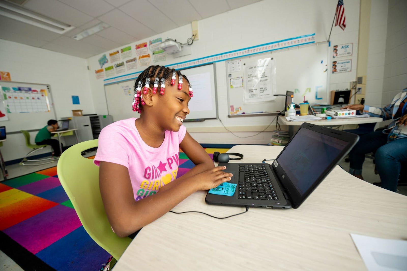 Student sitting at a desk on a laptop