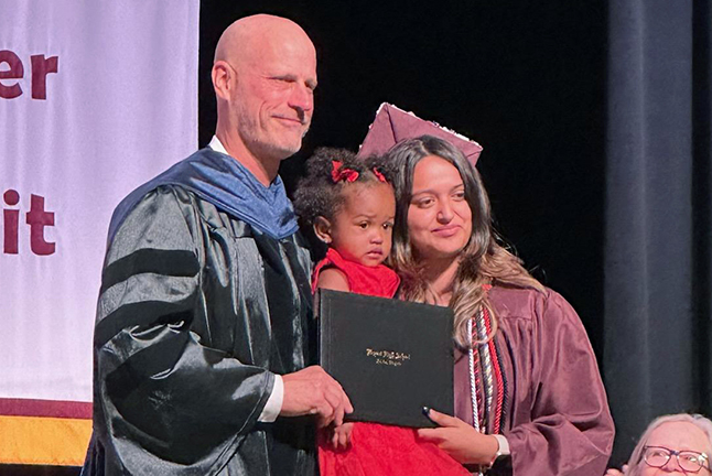 student and Principal at graduation