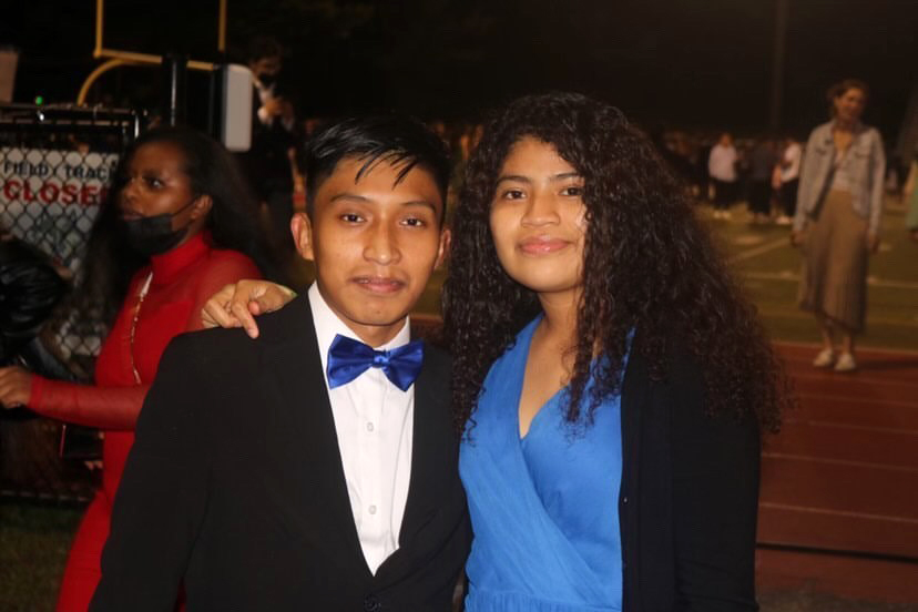 Students at Justice High School attend Homecoming dance on the football field.